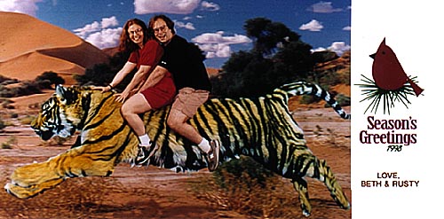 Beth and Rusty riding a tiger, Seasons' Greetings!